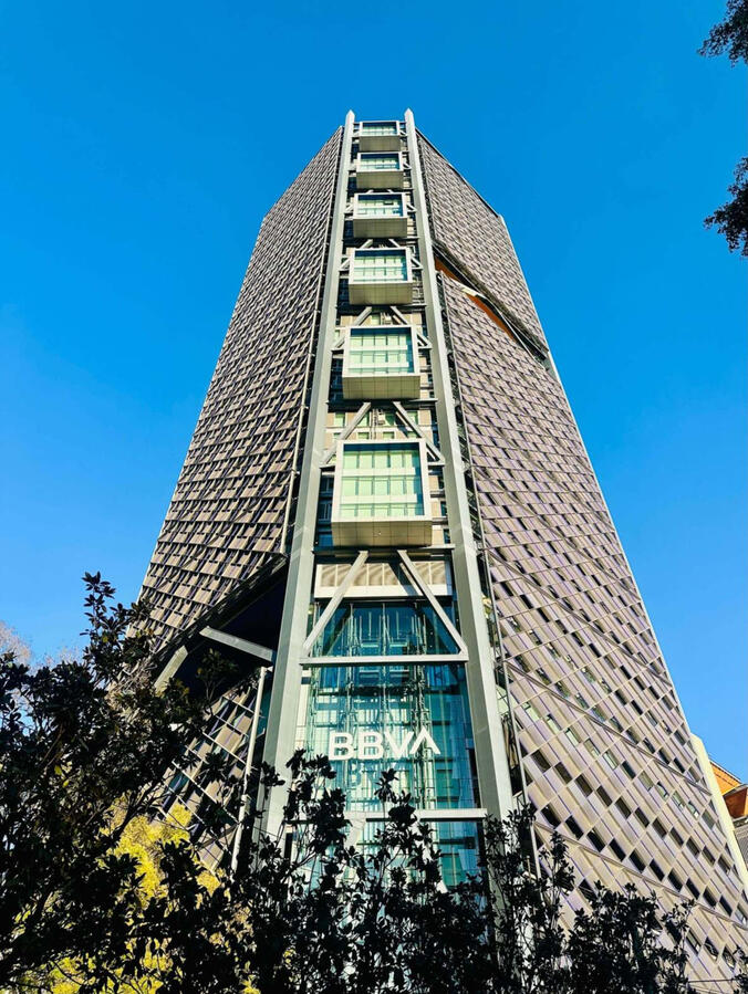 BBVA Tower: Modern Mexico City Architecture Low-angle view of the iconic BBVA skyscraper against, highlighting the modern architectural skyline of Mexico City's financial district.