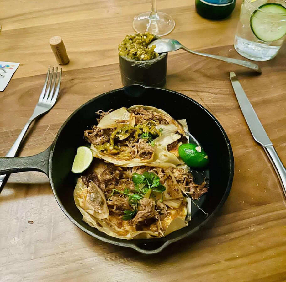 Gourmet Mexican Flavors Delicious gourmet tacos served in a cast-iron skillet, during a private experience in Mexico City.