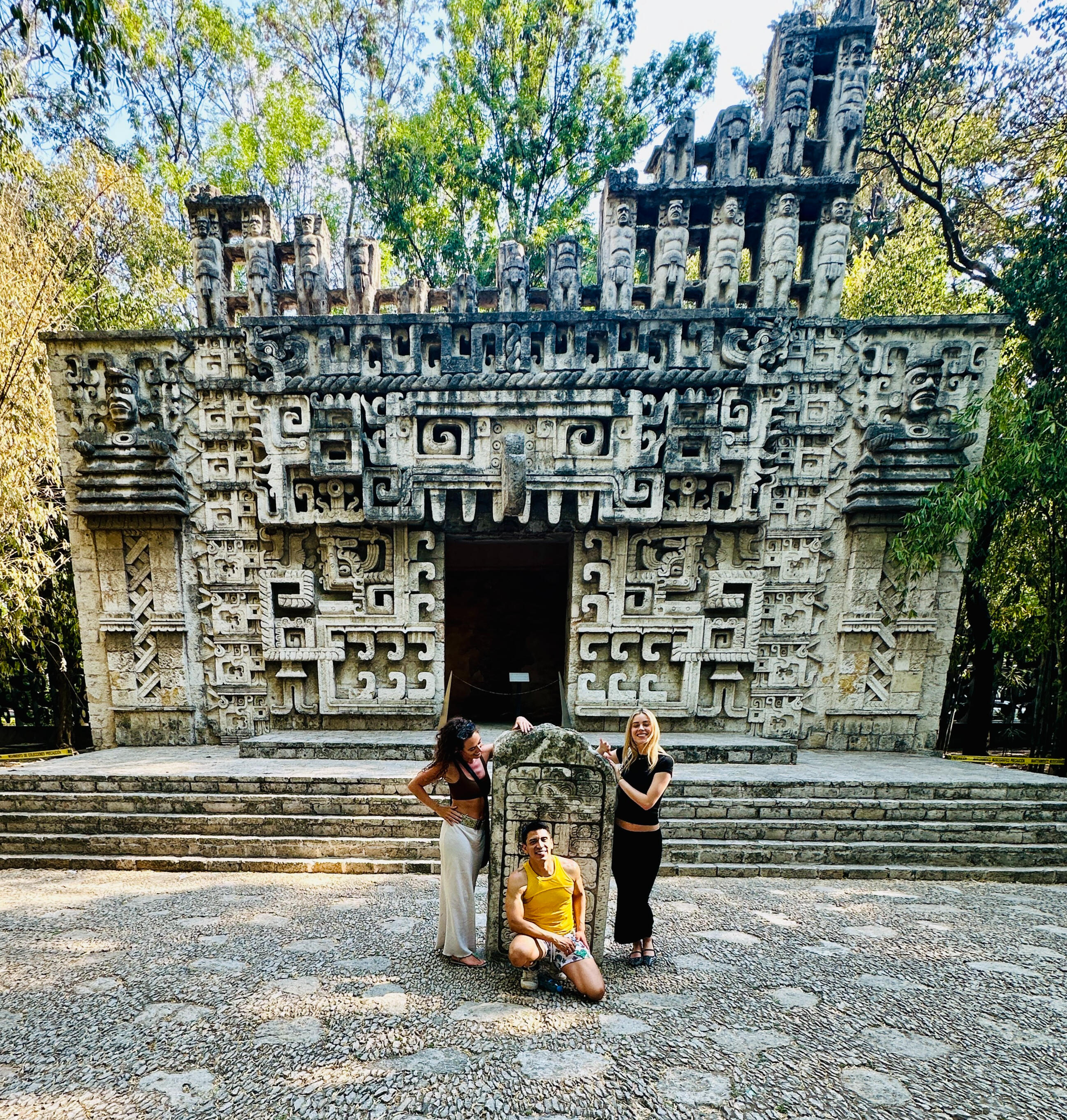 Unforgettable Cultural Connection at the Anthropological Museum Erik and friends posing in front of the impressive carved stone facade during a curated private tour at Mexico City's Anthropology Museum