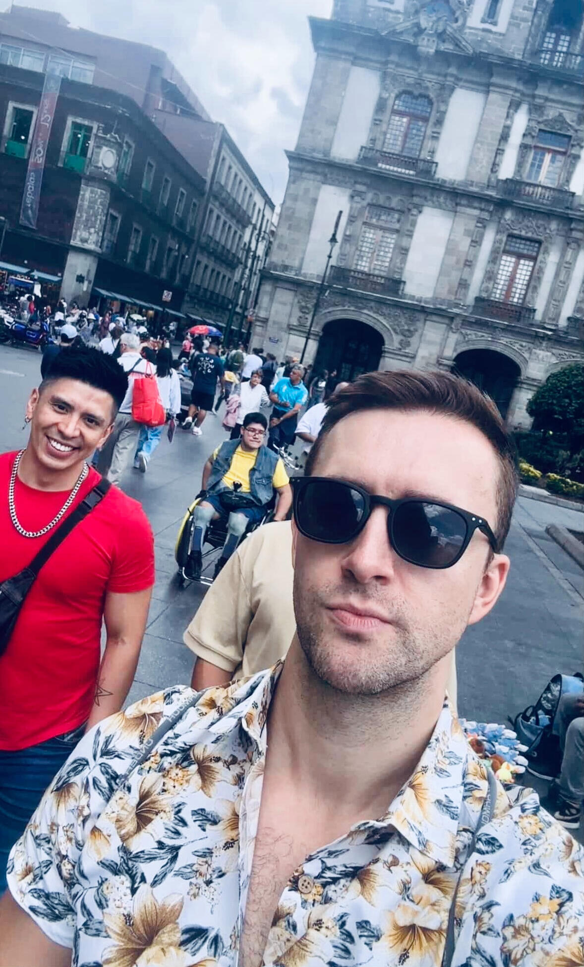 CDMX Centro Historico Walking Tour Guide Erik smiling with a guest during a lively private walking tour in the historic heart of Mexico City.
